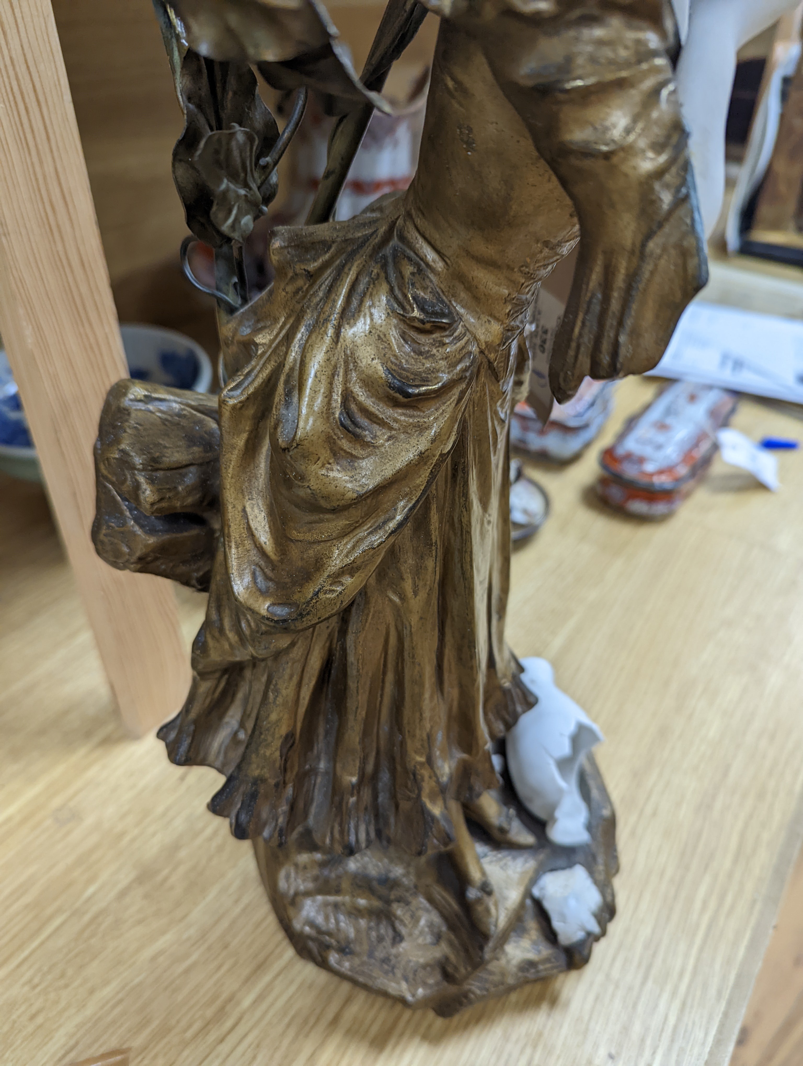 A late 19th Century French gilt spelter and bisque porcelain figure after Mednat 54cm